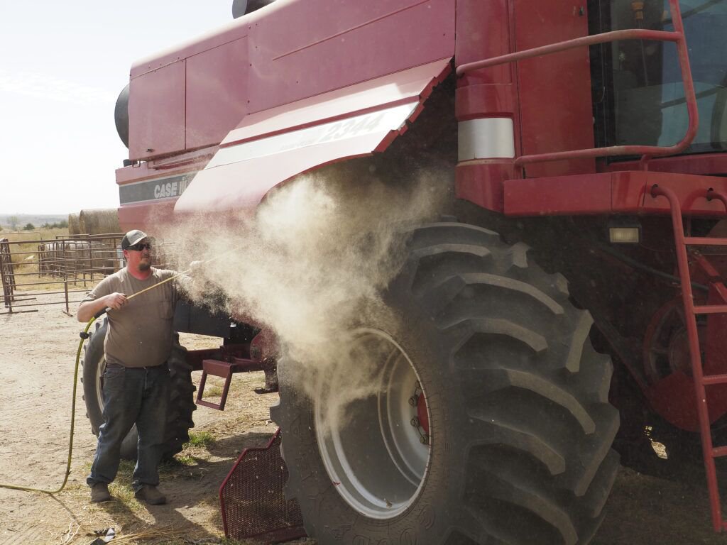 Jeremy Crosley cleans a combine