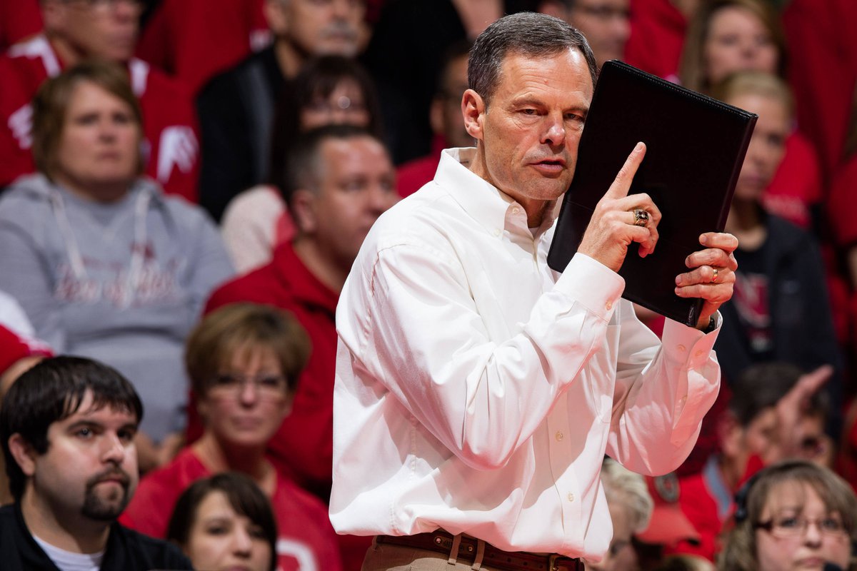 Nebraska Volleyball head coach John Cook signals a play during a match.